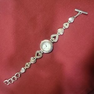 Brighton Genoa Woman's watch Silver w/gold accents.